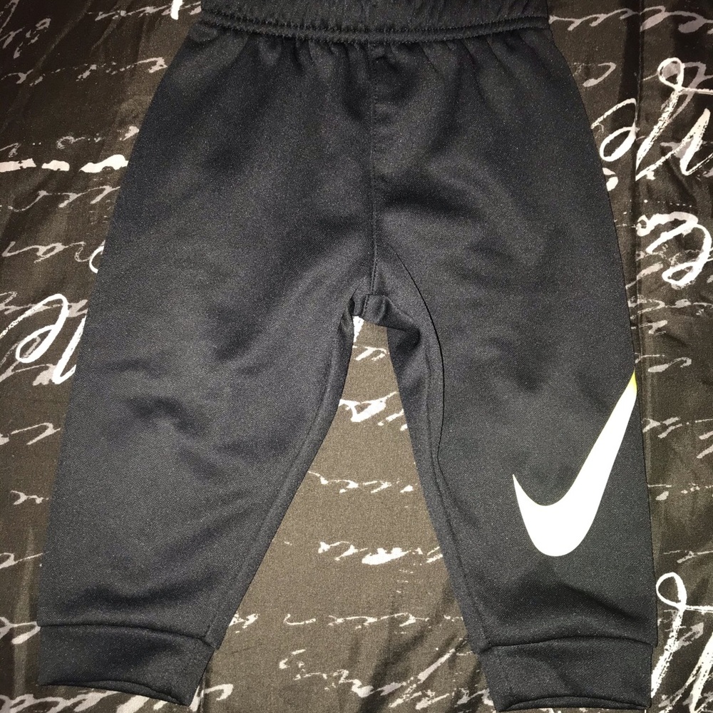2 dry fit Nike shirts and jogger pants. Baby size